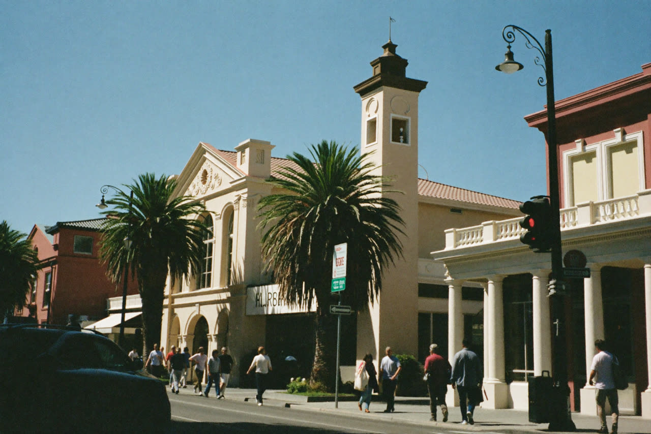 Downtown Santa Barbara, with palm trees and white stucco storefronts