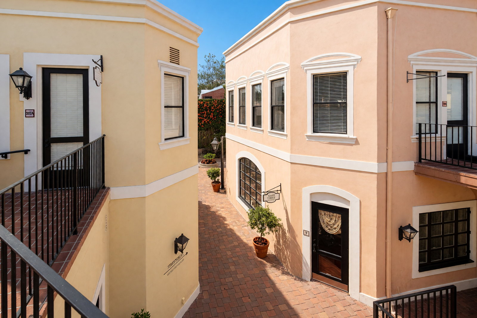 The Victoria Court courtyard. Our office, Suite 204, is the upper door at the right.